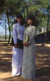 The ao dai (Vietnamese: áo dài) is a Vietnamese national costume, now most commonly for women. In its current form, it is a tight-fitting silk tunic worn over pantaloons. The word is pronounced ow-zye in the north and ow-yai in the south, and translates as 'long dress'.<br/><br/>

The name áo dài was originally applied to the dress worn at the court of the Nguyễn Lords at Huế in the 18th century. This outfit evolved into the áo ngũ thân, a five-paneled aristocratic gown worn in the 19th and early 20th centuries. Inspired by Paris fashions, Nguyễn Cát Tường and other artists associated with Hanoi University redesigned the ngũ thân as a modern dress in the 1920s and 1930s.